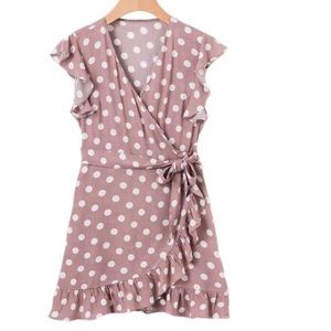 Mauve polka dot frilly dress.
